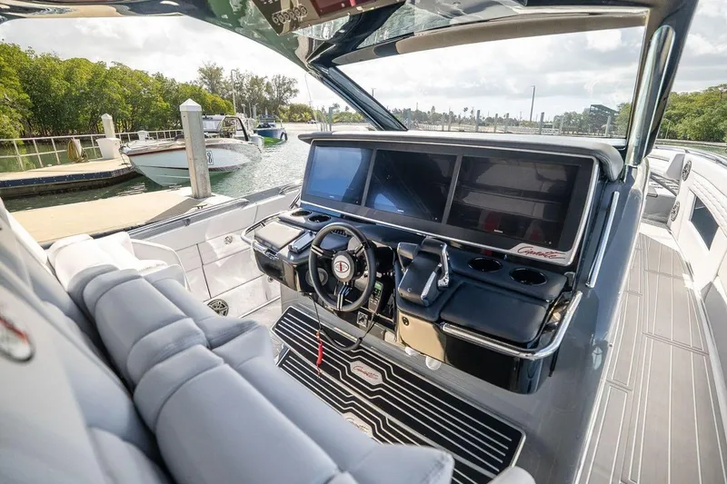 Slide: The Image of 2026 Cigarette 42' Auroris luxury boat cockpit with advanced navigation screens and sleek design. - 5