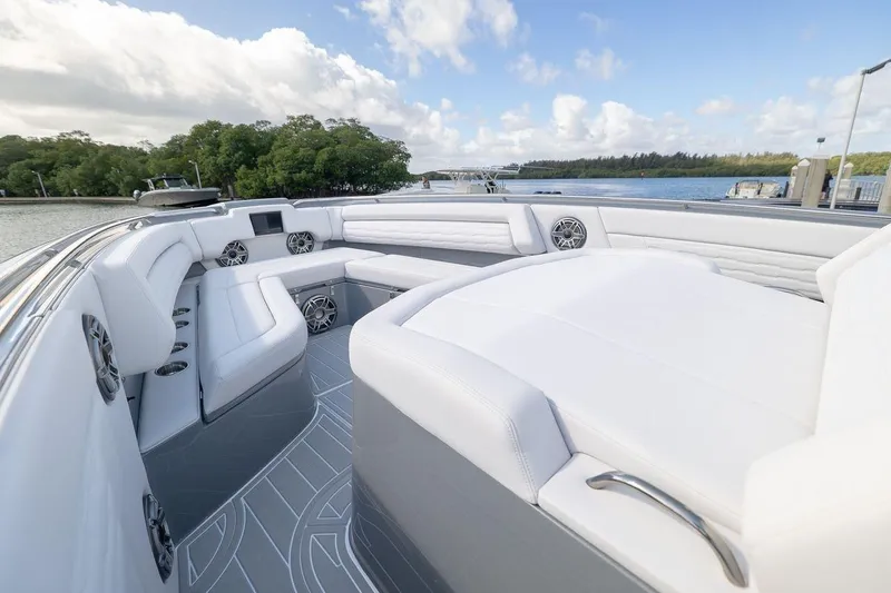 Slide: The Image of Luxurious 2026 Cigarette 42' Auroris boat interior with white seating and scenic water view. - 7