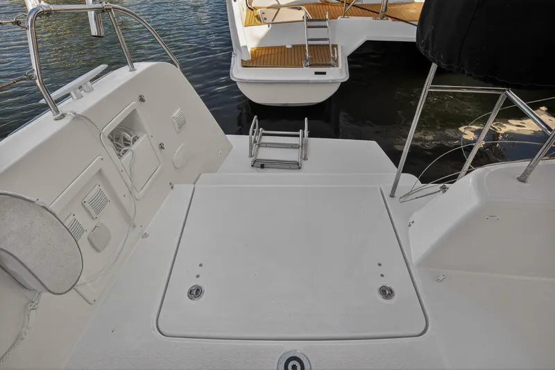 Slide: The Image of 2019 Lagoon 42 yacht stern view with swim platform and ladder. - 25