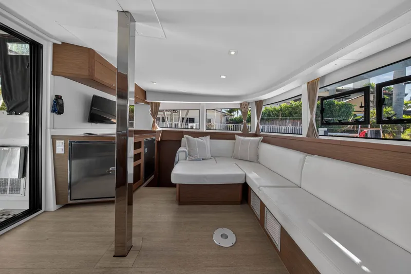 Slide: The Image of Luxurious interior of 2019 Lagoon 42 catamaran with modern seating and large windows. - 56