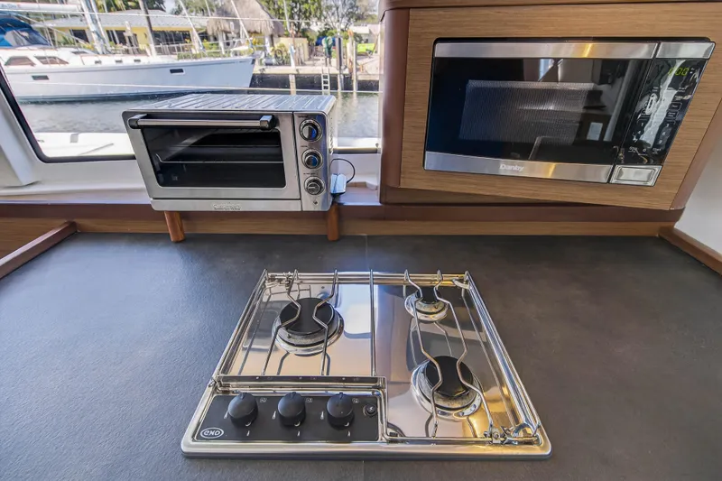 Slide: The Image of Modern kitchen in 2019 Lagoon 42 yacht with stove, oven, and microwave. - 62