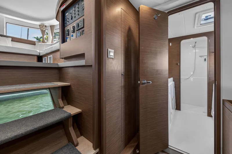 Slide: The Image of Interior of 2019 Lagoon 42 catamaran featuring wooden finishes and modern design elements. - 85