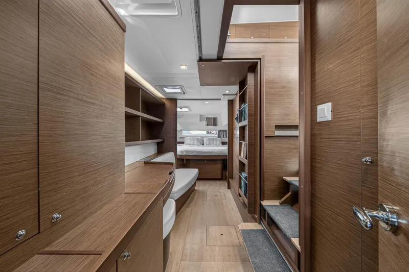 Slide: The Image of Luxurious interior of 2019 Lagoon 42 yacht with modern wood finish and cozy bedroom. - 86