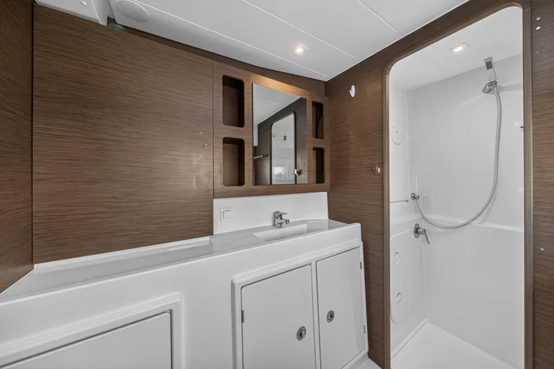 Slide: The Image of Modern bathroom interior of 2019 Lagoon 42 yacht with wood accents and shower. - 87