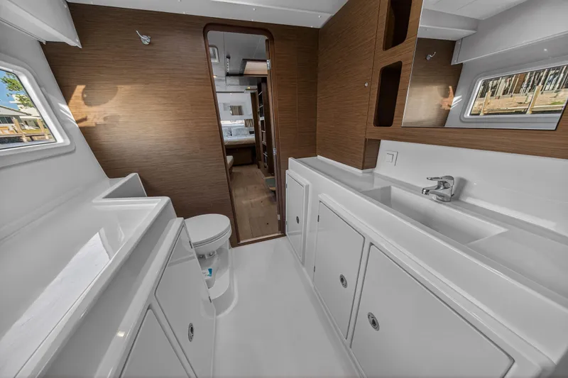 Slide: The Image of Interior of 2019 Lagoon 42 yacht bathroom with modern fixtures and wood accents. - 89