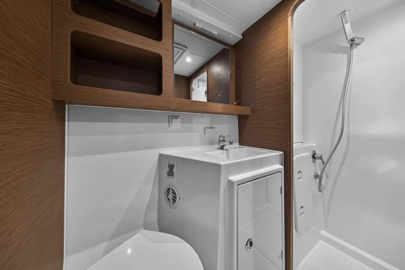 Slide: The Image of Modern bathroom in 2019 Lagoon 42 yacht with sleek wood accents and compact design. - 95