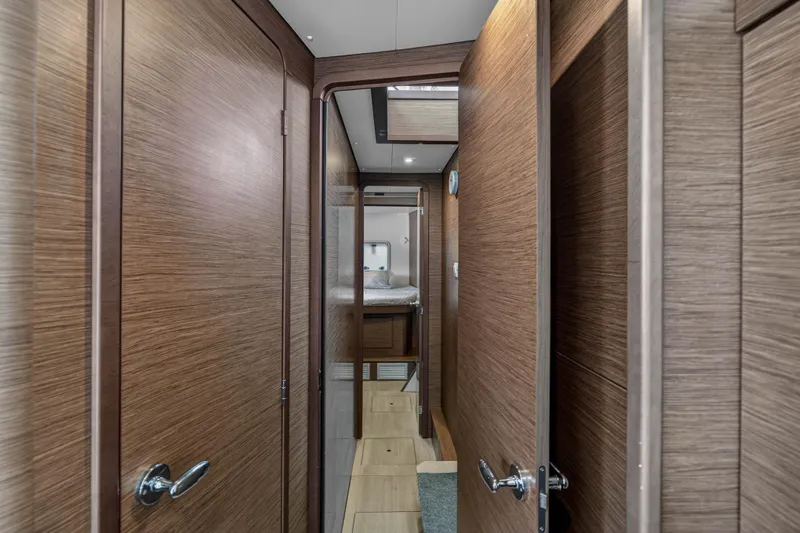 Slide: The Image of Interior hallway of 2019 Lagoon 42 yacht with wooden doors and modern design. - 97