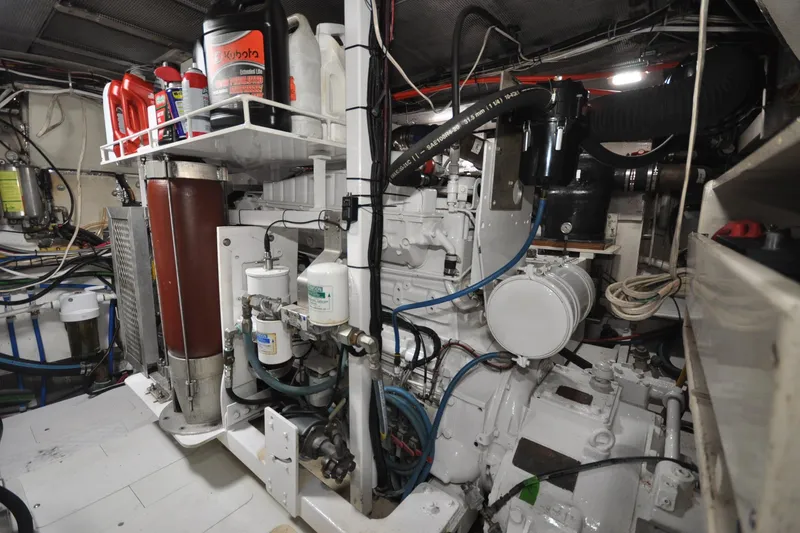 Slide: The Image of Engine room of 1982 Custom Virpack Steelhull with various mechanical components and storage containers. - 19