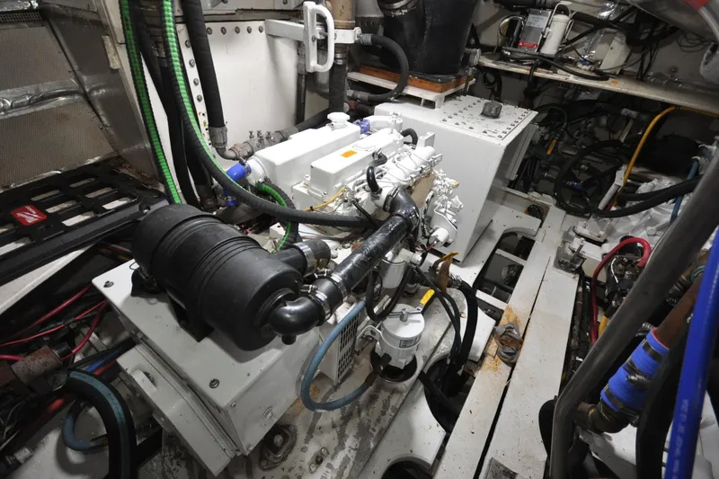 Slide: The Image of Engine room of 1982 Custom Virpack Steelhull with complex machinery and wiring. - 22