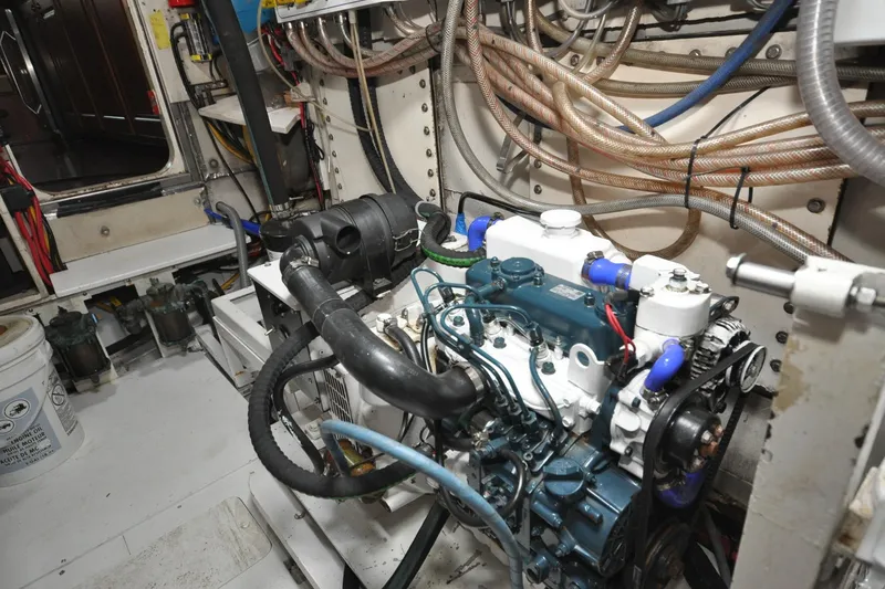 Slide: The Image of Engine room of 1982 Custom Virpack Steelhull with visible machinery and wiring. - 25