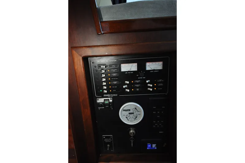 Slide: The Image of Control panel of 1982 Custom Virpack Steelhull boat with gauges and switches. - 28