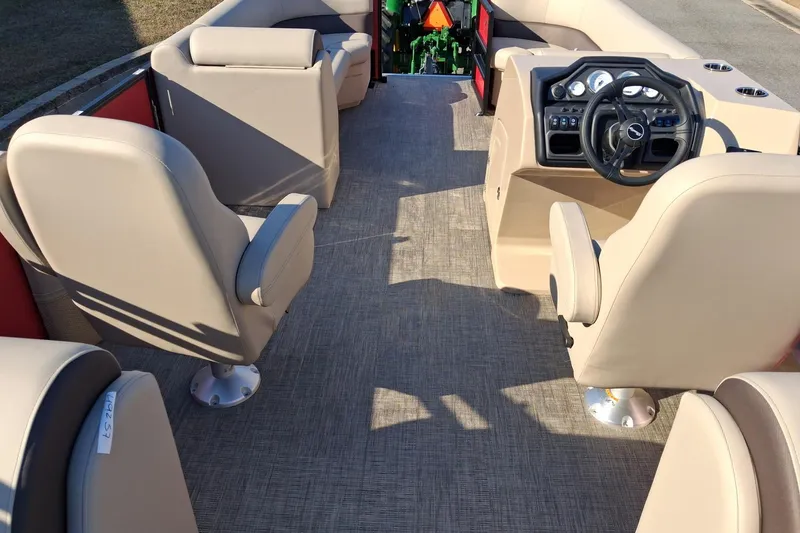 Slide: The Image of 2026 Bentley Pontoons Legacy 240 Navigator interior with beige seating and modern dashboard. - 5