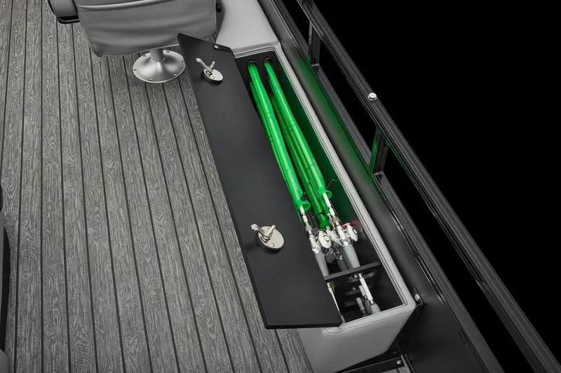 Slide: The Image of Manufacturer Provided Image: 2026 Ranger 220FC boat with fishing rod storage compartment and sleek gray flooring. - 32