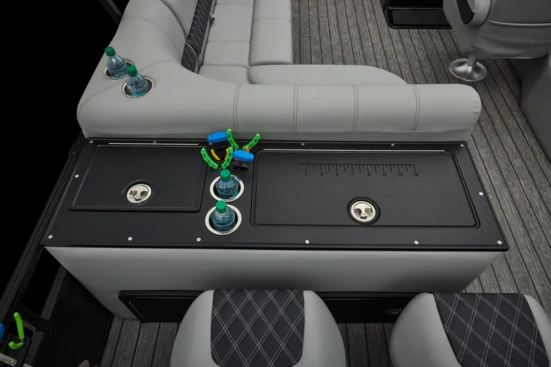 Slide: The Image of Manufacturer Provided Image: 2026 Ranger 220FC boat interior with seating, cup holders, and storage compartments. - 39