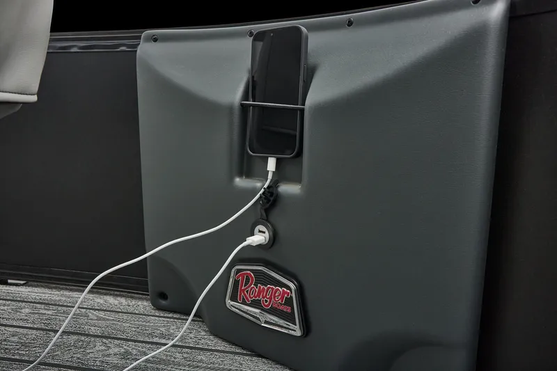 Slide: The Image of Manufacturer Provided Image: Charging station on 2026 Ranger 220FC boat with phone and USB cable. - 46