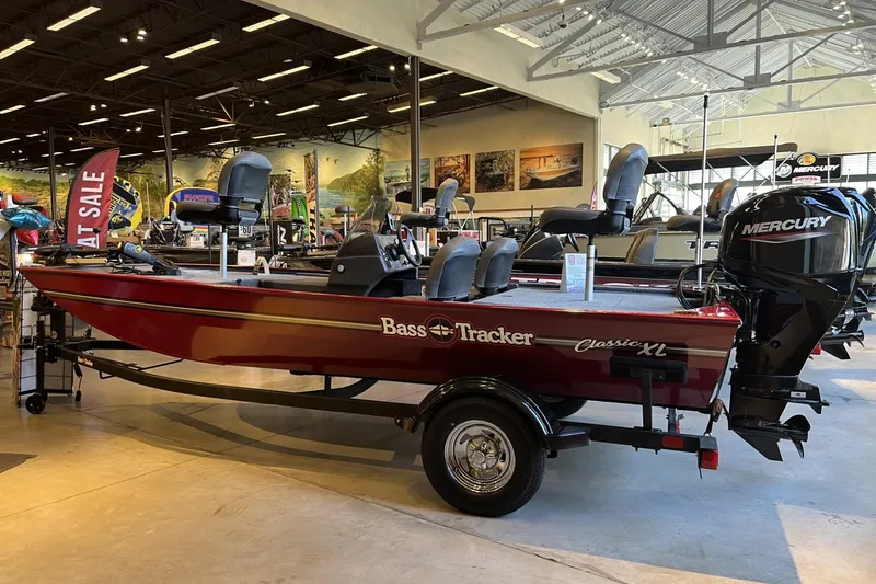The Image of 2026 Tracker Bass Tracker Classic XL boat on display in showroom with Mercury engine. - 0