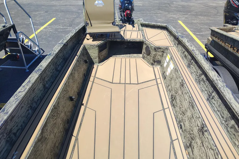 Slide: The Image of 2026 Tracker Grizzly 1650 T Prairie Wings Edition boat interior with camouflage design. - 37