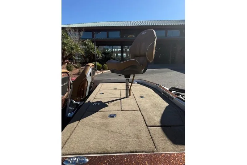 Slide: The Image of 2026 Ranger Z521R Cup-Equipped boat with elevated seat, outdoor setting. - 11