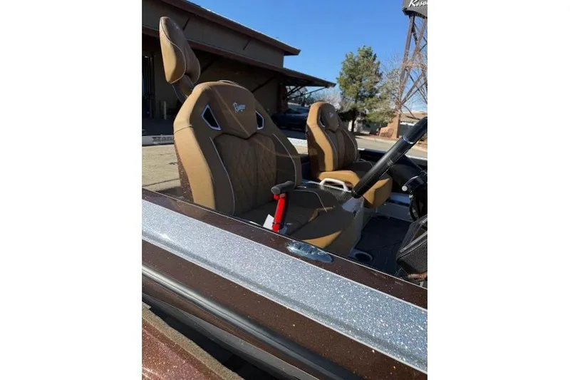 Slide: The Image of 2026 Ranger Z521R Cup-Equipped boat with brown seats and steering wheel. - 12