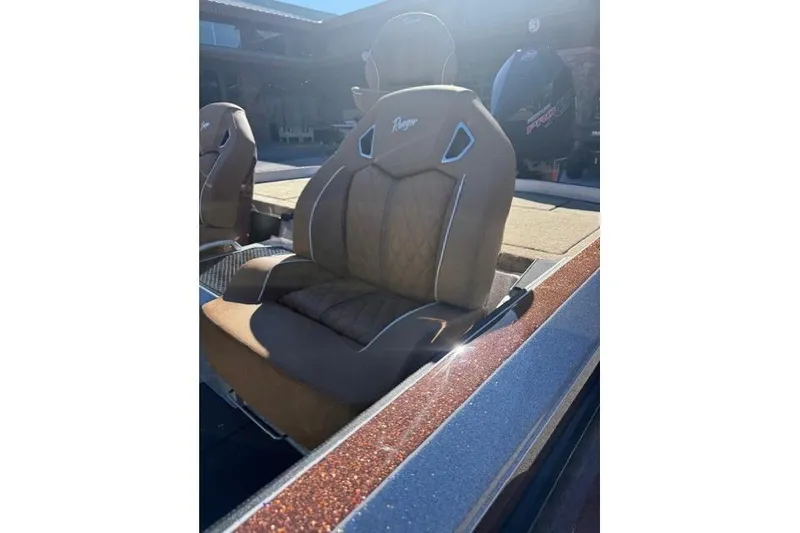 Slide: The Image of 2026 Ranger Z521R Cup-Equipped boat seat with brown upholstery and sleek design. - 13