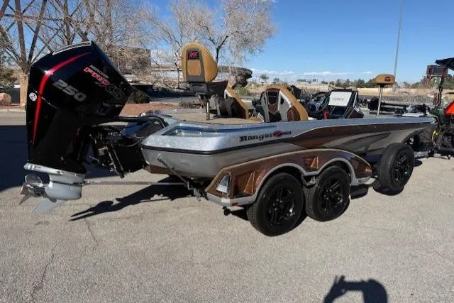 Slide: The Image of 2026 Ranger Z521R Cup-Equipped boat with powerful engine, parked outdoors on a sunny day. - 2