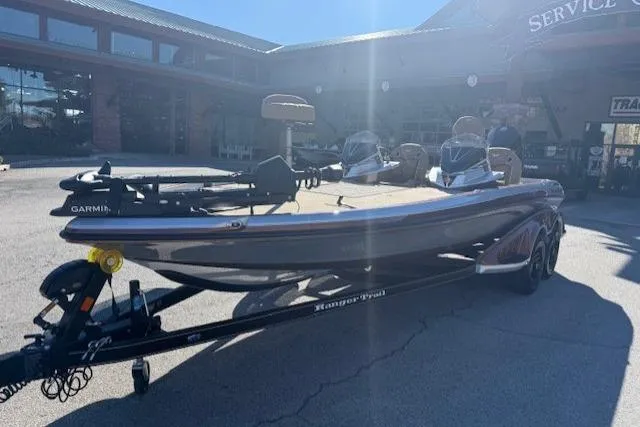 Slide: The Image of 2026 Ranger Z521R Cup-Equipped boat on trailer, parked outside a service center. - 3