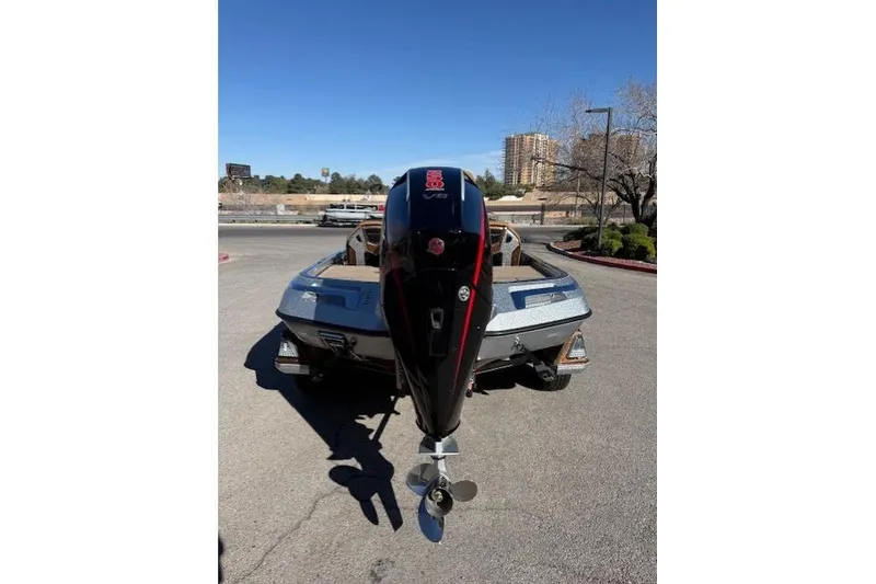 Slide: The Image of 2026 Ranger Z521R Cup-Equipped boat with powerful outboard motor, parked outdoors. - 5