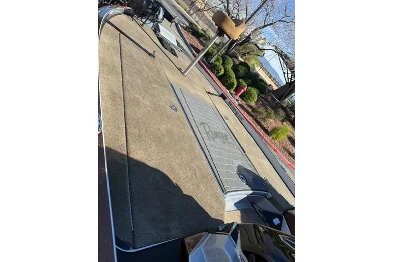 Slide: The Image of 2026 Ranger Z521R Cup-Equipped boat deck with storage compartment and fishing seat. - 8