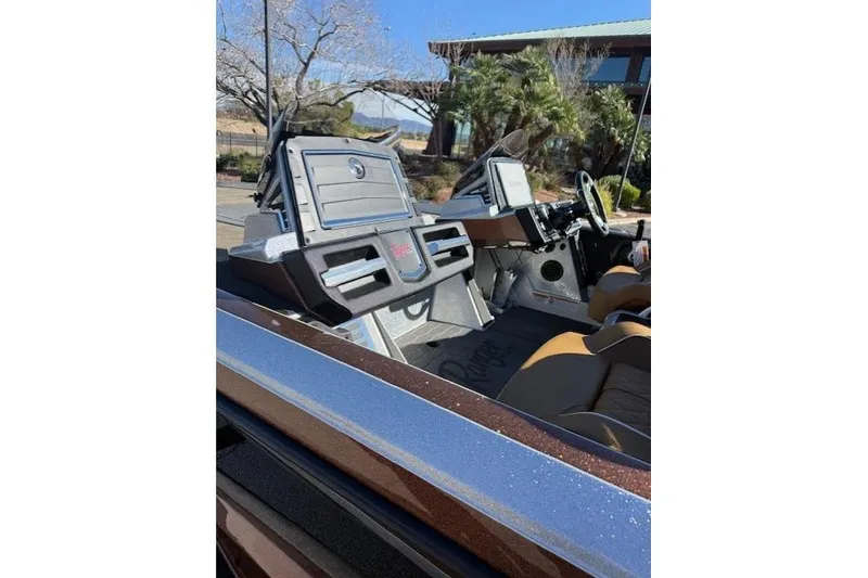 Slide: The Image of 2026 Ranger Z521R Cup-Equipped boat interior with advanced dashboard and seating. - 9