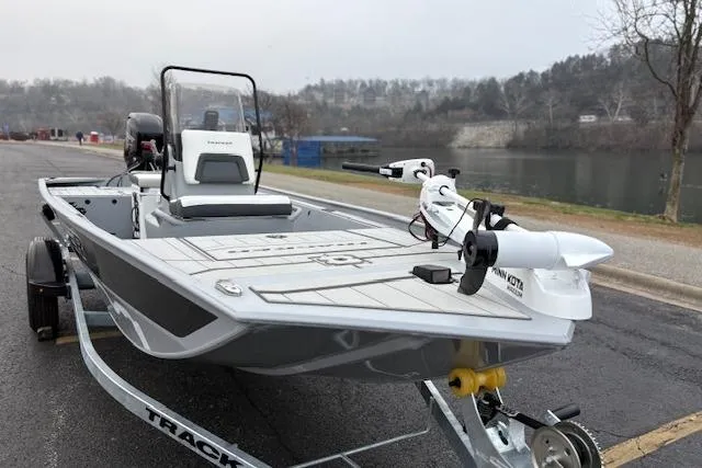 Slide: The Image of 2026 Tracker Bass Tracker Classic CC boat on trailer by a lake. - 15