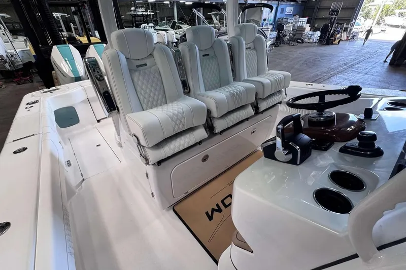 Slide: The Image of Luxury interior of 2026 Phenom 37 boat with plush seating and modern controls. - 3