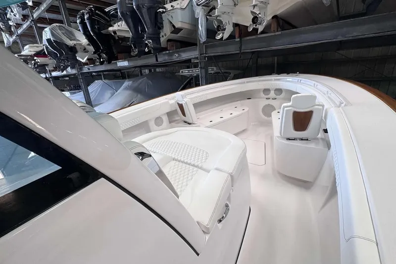 Slide: The Image of Luxurious interior of 2026 Phenom 37 boat with white seating and modern design. - 5
