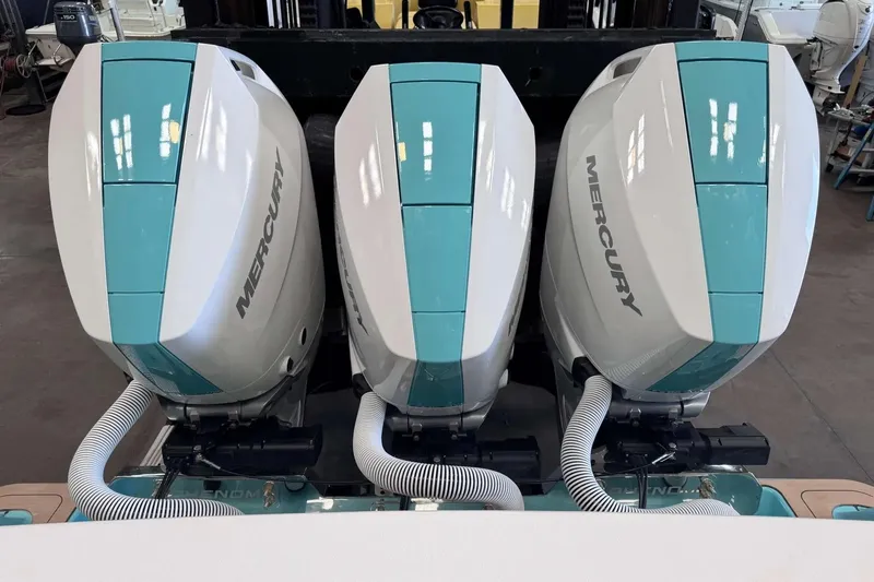 Slide: The Image of Triple Mercury outboard engines on a 2026 Phenom 37 boat, featuring sleek design and modern technology. - 6
