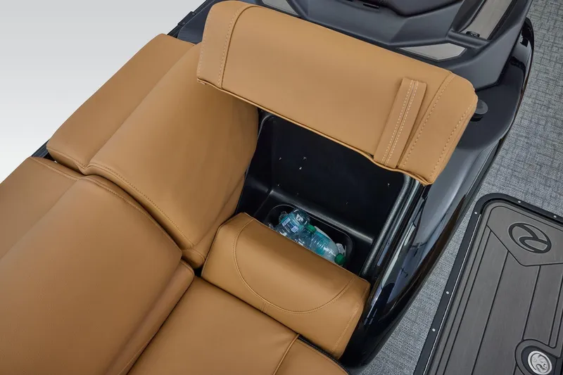 Slide: The Image of Luxurious tan leather seating with storage compartment in 2026 Regency 230 DL boat. - 18