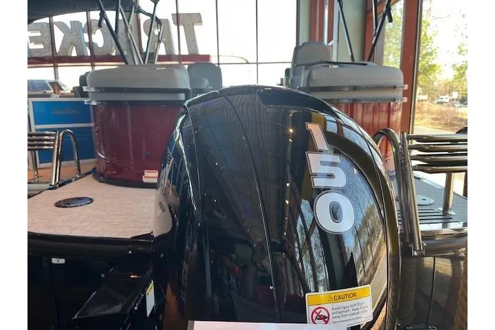 Slide: The Image of 2026 Regency 230 DL boat with 150 horsepower engine in showroom. - 5