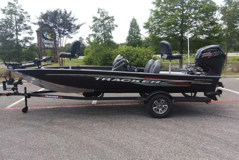 The Image of 2026 Tracker Pro Team 190 boat on trailer at Outdoor World parking lot. - 0