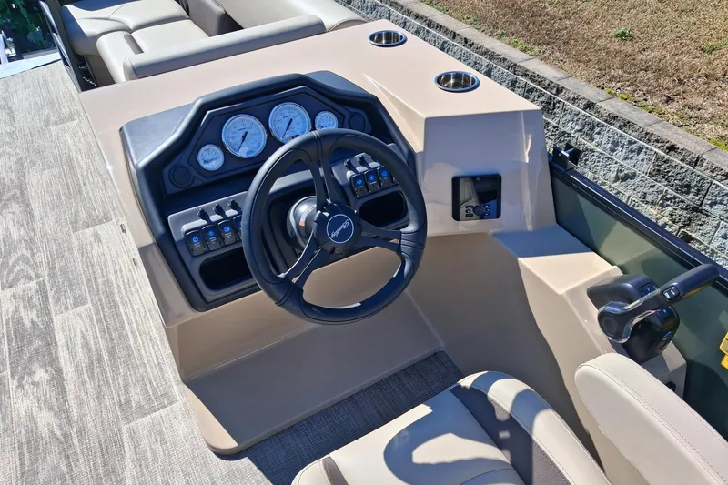 Slide: The Image of 2026 Bentley Pontoons Legacy 240 Swingback dashboard with steering wheel and control panel. - 6