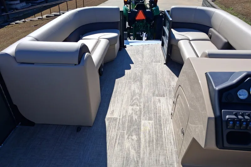 Slide: The Image of 2026 Bentley Pontoons Legacy 240 Swingback interior with luxurious seating and modern dashboard. - 7
