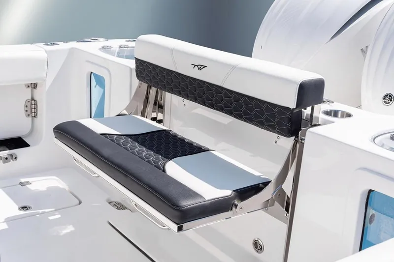 Slide: The Image of 2026 Tidewater 282 CC Adventure boat interior with seating and speakers. - 11