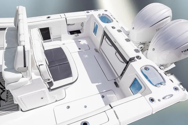 Slide: The Image of 2026 Tidewater 282 CC Adventure boat interior with open storage compartments. - 13