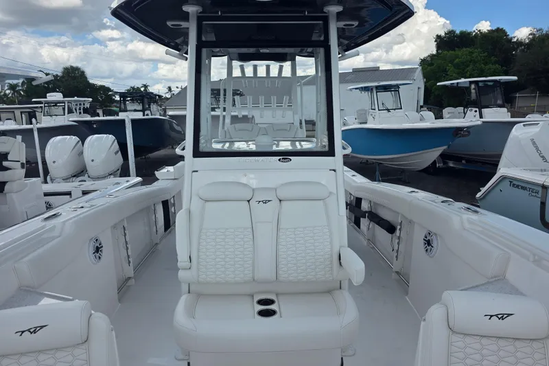 Slide: The Image of 2026 Tidewater 282 CC Adventure boat interior with white seating and modern design. - 14