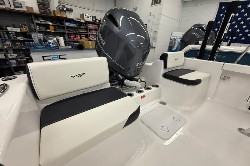 Slide: The Image of 2026 Tidewater 180 CC Adventure boat interior with Yamaha engine in showroom. - 3