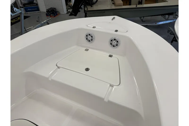 Slide: The Image of 2026 Tidewater 180 CC Adventure boat interior with storage compartment and speakers. - 6