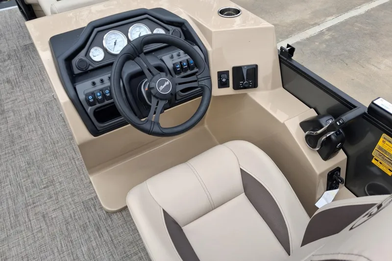 Slide: The Image of 2026 Bentley Pontoons Legacy 240 DL Navigator helm with steering wheel and control panel. - 6