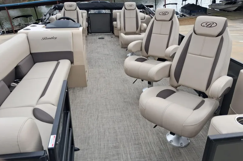 Slide: The Image of 2026 Bentley Pontoons Legacy 240 DL Navigator interior with luxurious seating and elegant design. - 8