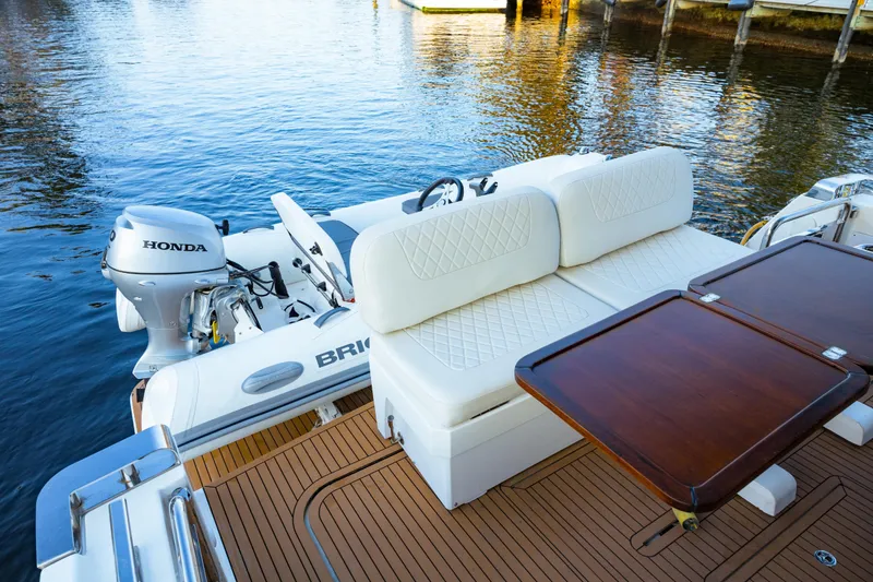 Slide: The Image of 2013 Bavaria Virtess 420 Fly yacht with Honda outboard motor and elegant seating area. - 11