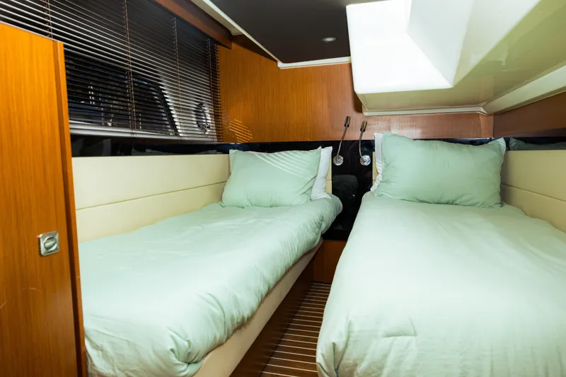 Slide: The Image of Interior of 2013 Bavaria Virtess 420 Fly yacht with twin beds and wooden accents. - 14