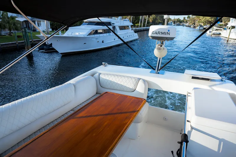 Slide: The Image of Flybridge view of 2013 Bavaria Virtess 420 Fly yacht with Garmin equipment on a scenic waterway. - 18