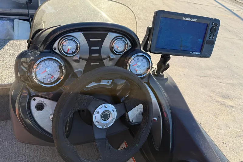 Slide: The Image of 2020 Tracker Pro Team 175 TF dashboard with gauges and Lowrance fish finder. - 11