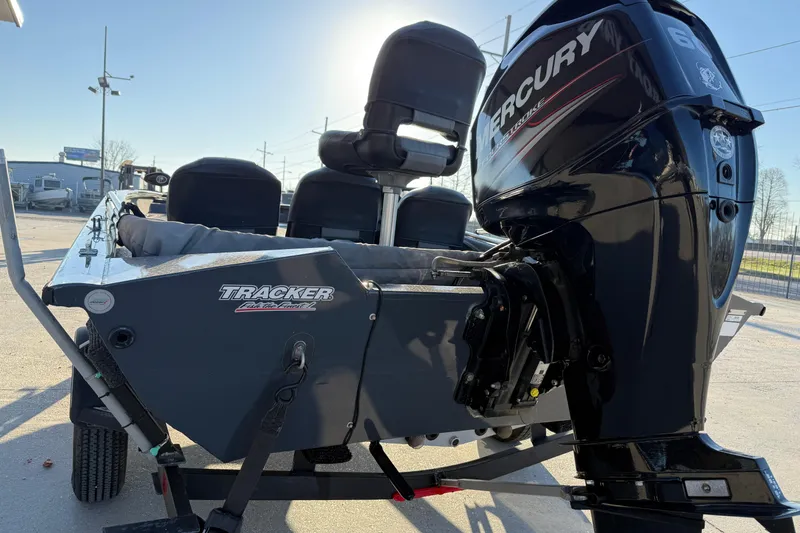 Slide: The Image of 2020 Tracker Pro Team 175 TF boat with Mercury engine, parked outdoors. - 4